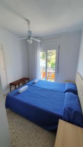 Postel nebo postele na pokoji v ubytování Hostal Cruz
