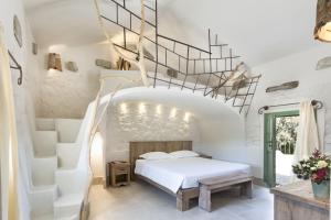Postel nebo postele na pokoji v ubytování Gallicantu Stazzo Retreat