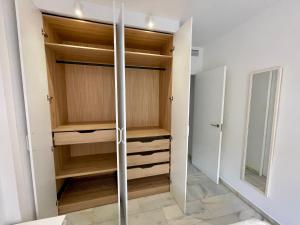 A bed or beds in a room at Apartamentos Valparaiso II