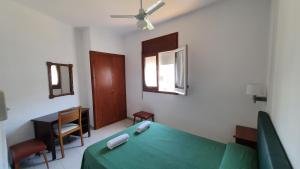 Postel nebo postele na pokoji v ubytování Hostal Cruz