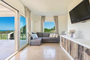 TV a/nebo společenská místnost v ubytování Villa Aloha Torre Pali