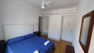 Postel nebo postele na pokoji v ubytování Hostal Cruz