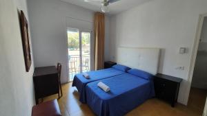 Postel nebo postele na pokoji v ubytování Hostal Cruz