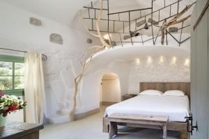 Postel nebo postele na pokoji v ubytování Gallicantu Stazzo Retreat