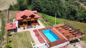 an overhead view of a house with a swimming pool at Vila Rudnicka Idila in Gornji Milanovac