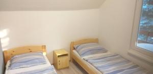 Posteľ alebo postele v izbe v ubytovaní Szépvölgyi Apartmanház