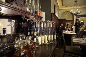a bar with a bunch of bottles of wine at Hotel Weißes Kreuz in Bregenz