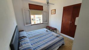Postel nebo postele na pokoji v ubytování Hostal Cruz