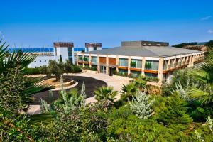 an aerial view of a building with a garden at Karpaz Gate Marina Hotel in Ayia Trias