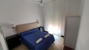 Postel nebo postele na pokoji v ubytování Hostal Cruz