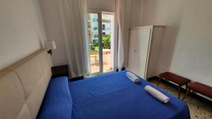 Postel nebo postele na pokoji v ubytování Hostal Cruz