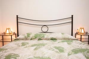 En eller flere senge i et værelse på Casa L'Antica Oliveta