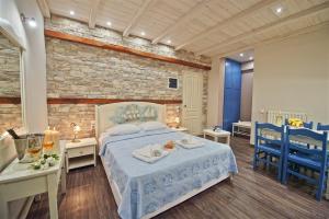 Postel nebo postele na pokoji v ubytování Flamingo Hotel Pelion - Seaside Superior Studios & Suites