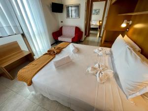 Łóżko lub łóżka w pokoju w obiekcie Hotel Rosa Caorle