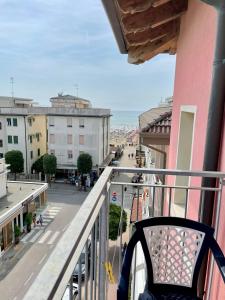 a balcony of a building with a view of a street at Hotel Rosa Caorle in Caorle