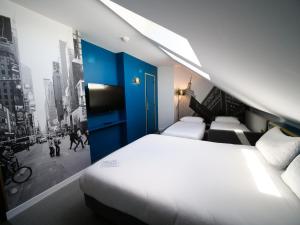 Кровать или кровати в номере ibis Styles Chartres Métropole