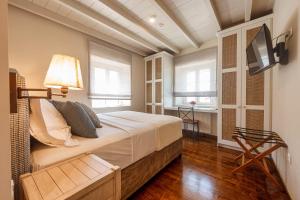 Ein Bett oder Betten in einem Zimmer der Unterkunft Achillion Casa Conti 1840