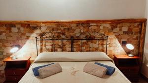 A bed or beds in a room at Agriturismo Gragonti, Arbus Costa Verde