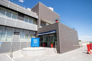 a building with a sign in front of it at Alda Route 42 in Illescas