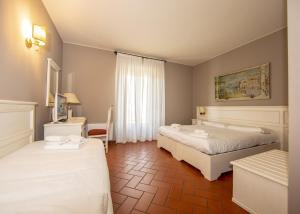 Cama ou camas em um quarto em Hotel Il Gelso