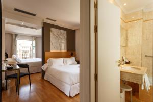 Postel nebo postele na pokoji v ubytování Hotel Dauro Premier