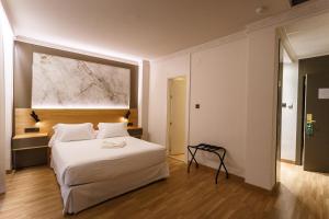 Postel nebo postele na pokoji v ubytování Hotel Dauro Premier