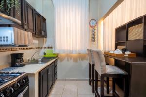 Kuchyň nebo kuchyňský kout v ubytování Acogedor estudio 7 en la Zona Colonial + 21 fotografií