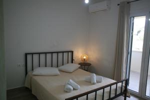 Posteľ alebo postele v izbe v ubytovaní Aeraki House
