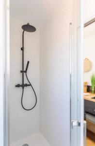 a shower in a bathroom with a shower at STUDIO ** ROOFTOP ** LULLI in Marseille