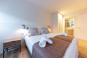 Posteľ alebo postele v izbe v ubytovaní Bravissimo Afra, 2-bedroom apartment