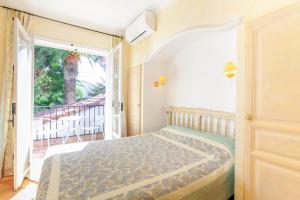 Postel nebo postele na pokoji v ubytování Hotel Villa Provencale