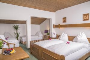 Posteľ alebo postele v izbe v ubytovaní Hotel Sonne