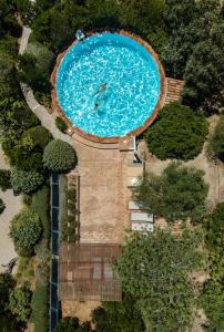 an overhead view of a large swimming pool at Altanure - Casa Terra Ecological Boutique Hotel in Tavira