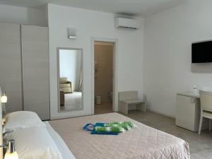 Postel nebo postele na pokoji v ubytování Alba D'Amore Hotel & Spa