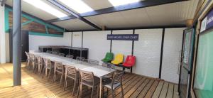 a row of tables and chairs in a room at Camping Insolite Le Haut Village in Saint-Michel-Chef-Chef +160 photos