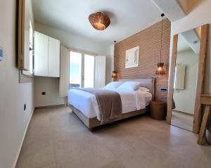 Cama ou camas em um quarto em Life Suites