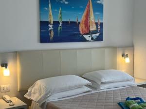 Postel nebo postele na pokoji v ubytování Alba D'Amore Hotel & Spa