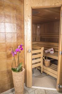 a plant in a pot in a sauna at Hotel Sonne in Wagrain