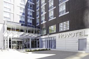 a large building with a large clock on the front of it at Novotel London Brentford in Brentford