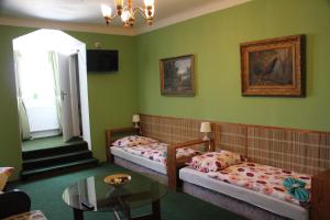Postel nebo postele na pokoji v ubytování Hotel Corrado
