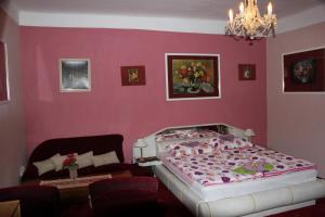 Postel nebo postele na pokoji v ubytování Hotel Corrado
