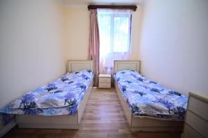 Postel nebo postele na pokoji v ubytování Sevan Comfortable Cottages by SeaSide