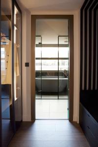 a glass door leading into a room with at Teight Hotel in Thessaloniki