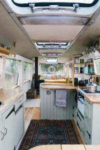 an interior view of a kitchen in an rv at Finest Retreats - Majestic Bus in Newchurch