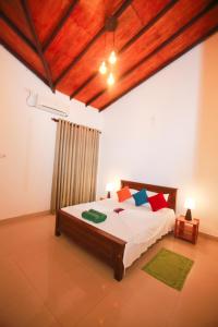מיטה או מיטות בחדר ב-Kandyan Fo Rest