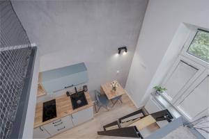an overhead view of a living room with a table and chairs at Parkside Fresh Apartments - Old Town Guesthouse in Krakow