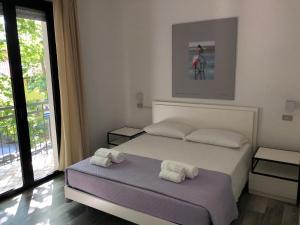 Кровать или кровати в номере Vinsea Hotel