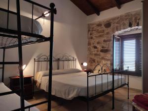A bed or beds in a room at Agriturismo Gragonti, Arbus Costa Verde
