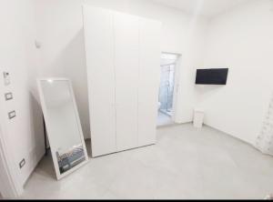 A television and/or entertainment centre at Dimora Asmara 11 15