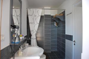 a bathroom with a toilet and a sink at Apartment Plaisir in Pogradec